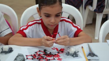 Child taking part in the Buckyball workshop