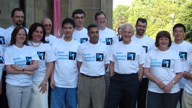 A group photo outside the Kroto Research Institute at the University of Sheffield.