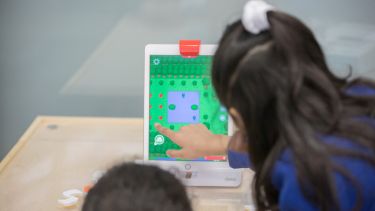 School children using digital tools