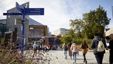 Students arriving at Students' Union with directional signage