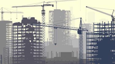 An illustration of a city's skyline showing cranes constructing buildings