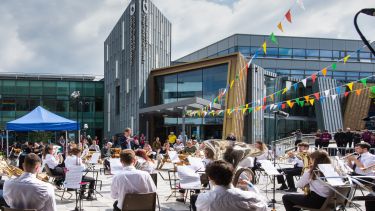 The University of Sheffield Brass Band outside Sheffield Students' Union