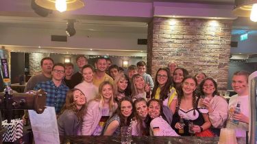 A group of german students on a night out. some wearing German traditional clothes