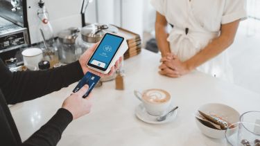 Person paying for a coffee 