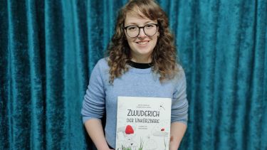 MA student and prize winner showing the cover of the children's book