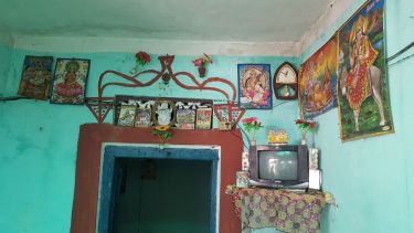 A TV set is given pride of place in a rural home in India