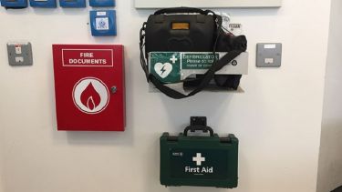 A close-up of the automated external defibrillator in The Diamond.