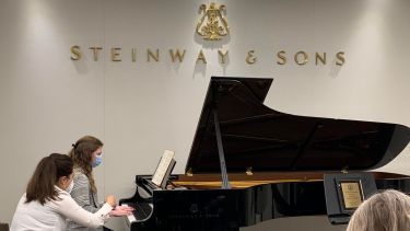 two pianists discussion at Steinway piano