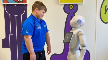 Brandon meets Pepper the robot at Sheffield Children's Hospital