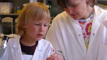 Dr Fiona Hunter working with a primary school pupil in the lab