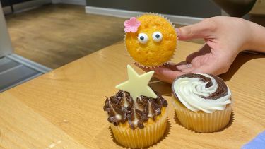 Photo of three decorated cupcakes