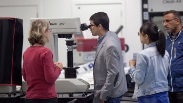 Student looking through a microscope