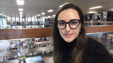 Photograph of Xhuljana in one of the University of Sheffield's library spaces