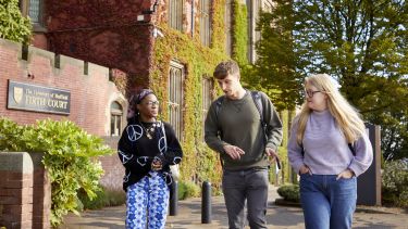 Students walking past Firth Court.