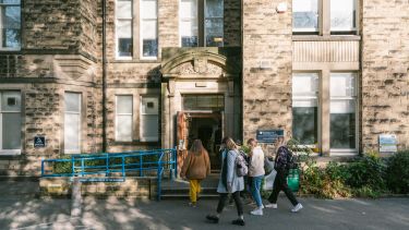 Politics students walking into the Elmfield building