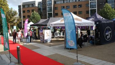 Photo of the red carpet, welcome flags, and stalls outside at Endcliffe for Intro Weekend 2021