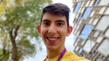 A selfie of Dimitris in front of The Diamond building