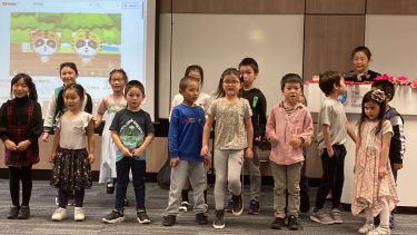 Students singing Chinese nursery rhymes