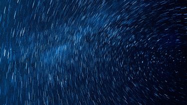A timelapse image of a starry night sky