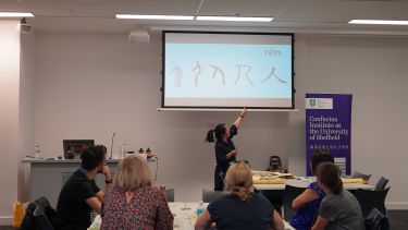 Teacher Tao Ting delivers calligraphy class