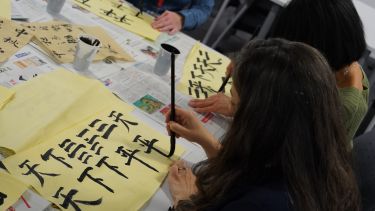 Students practices her calligraphy 