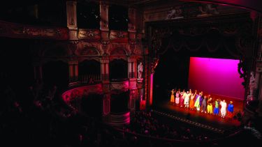 The inside of the Lyceum theatre, showing the stage from the back of the room