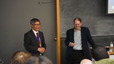 Photograph of Professor Zi-Qiang Zhu and Dr David Moule speaking to the audience at the IEEE Day Guest Lecture 