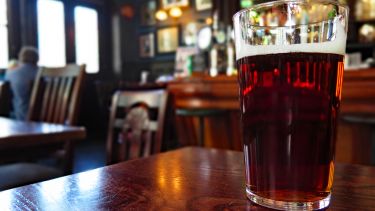 Pint of beer on a table in a pub