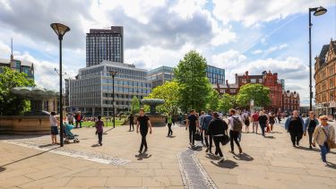 The busy walkway at the top of the Peace Gardens.