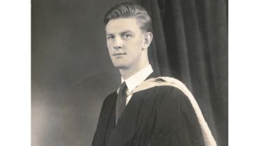 Arthur Hogg wearing the University of Sheffield graduation gown