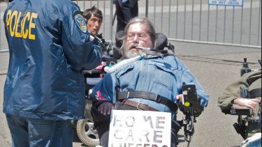 'Arrests of disability activists at protest of California health care budget cuts' by Steve Rhodes is licensed under CC BY-NC-SA 2.0.