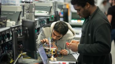 Photo of students working on their surgical robot 