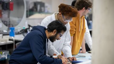 Three students in a UG practical lab class