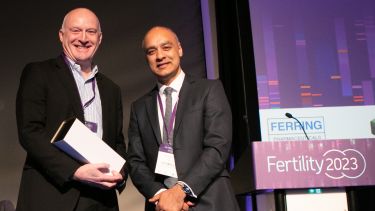 Professor Allan Pacey (left) accepting an award on stage