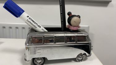 An image of a desk toy VW van symbolising movement 