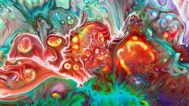 An abstract image featuring a variety of colours, swirling between one another