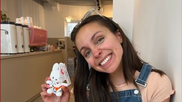 Student showing little Miffy doll