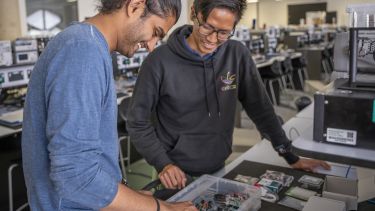 Students Ronak and Wei Theng working in the Electronics and Control Lab