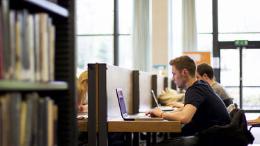 Students in Western Bank Library reading room