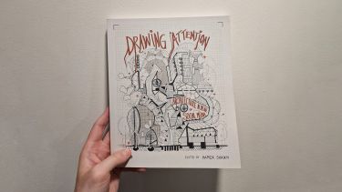 Hammad Holding "Drawing Attention" a new book featuring some of his work