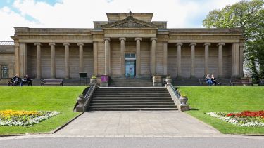 The path and steps leading up to the grand front of the Weston Park Museum building