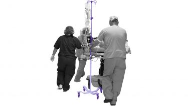 patient in hospital being carried on a stretcher
