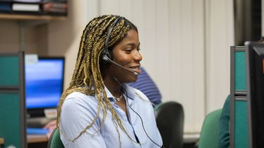 Student wearing headset in call room