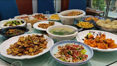 Table filled with Chinese food