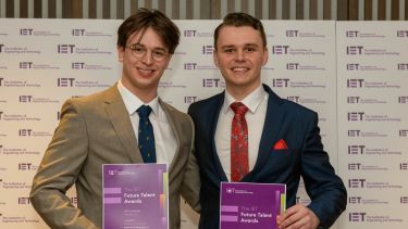 Photograph and Wilfred and Kacper holding certificates at the IET Future Talent Awards Scholarships ceremony