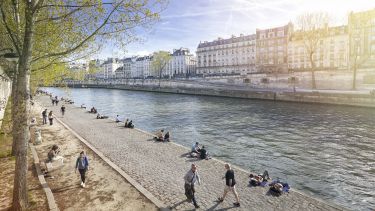 The River Seine walkway with Parisians relaxing, Paris, France