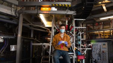 Person on EMU beamline with sample cell