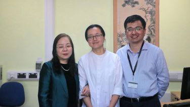 SCI Interim Director, Professor Li Xiao stands with Teacher Li Jia and SCI Deputy Director, Dr Zhang Daojian