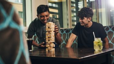 Image of students playing Jenga in accommodation
