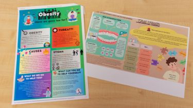 A photo of the two winning public health posters